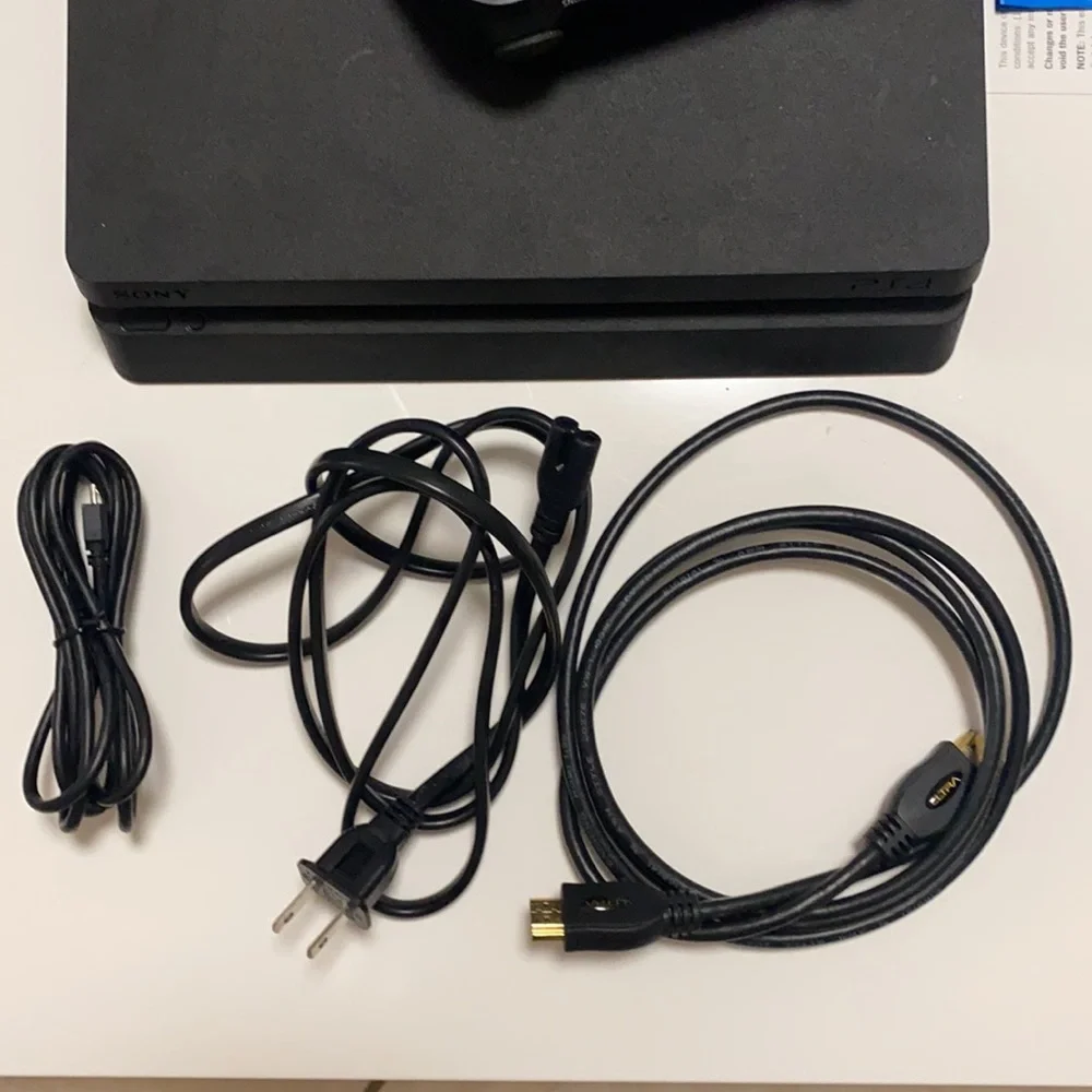 PlayStation 4 Slim 1TB Console and 5 Games